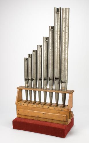 set of 8 flue organ pipes on wind chest