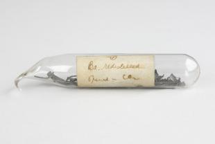 sealed glass tube of barium shavings