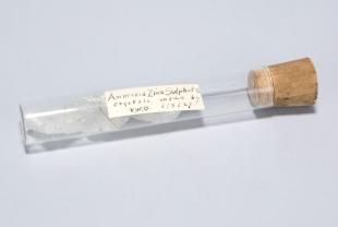 three ammonia zinc sulfate crystals in a stoppered glass test tube