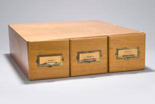 lantern slides on mechanics  in three-drawer wooden cabinet