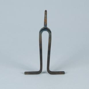 small steel tuning fork with bent tines